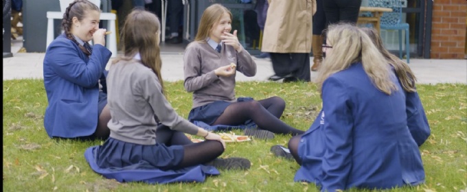 Girls eating lunch on the grass